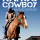 A man in rugged clothing rides a brown and white horse through a mountainous desert landscape under a clear blue sky. "Karoo Cowboy" and credits appear at the top of the image, perfectly encapsulating the spirit of Western adventure.