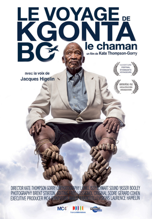 Poster of the film "Le Voyage de Kgonta Bo - Le Chaman" features an elderly man in traditional attire sitting against a white background, capturing a shaman’s journey. The film details and crew are listed, with festival accolades shown at the top right.