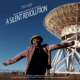 Poster for the film "Women in Science in Africa: A Silent Revolution". A smiling woman stands with arms outstretched in front of a large radio telescope. Text at the top lists film festivals and awards. The bottom lists participants and production credits.